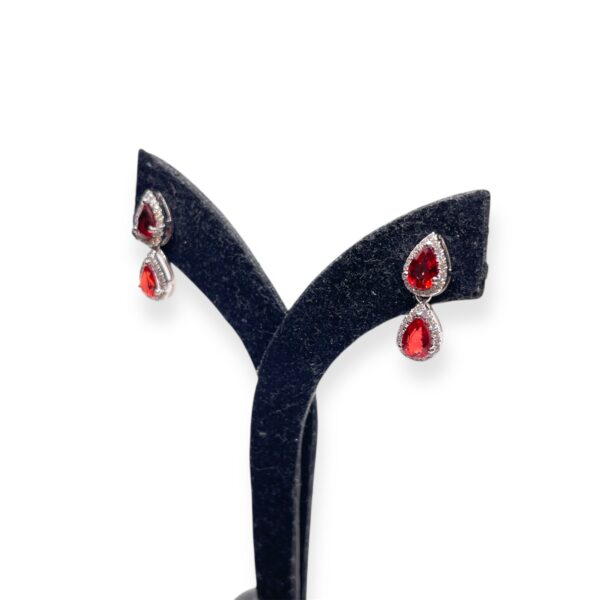 Beautiful pair of double drop ruby earrings with diamond cluster.