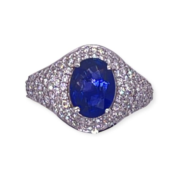 Blue sapphire and diamond ring in gold iced out
